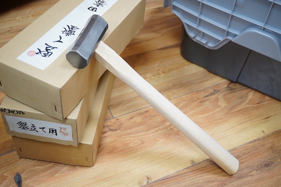 A collection of Japanese woodworking chisels and hammers, including; three boxed large mortise chisels, three boxed timber framing chisels (largest 90mm), and five heavy duty hammers/mallets (11)